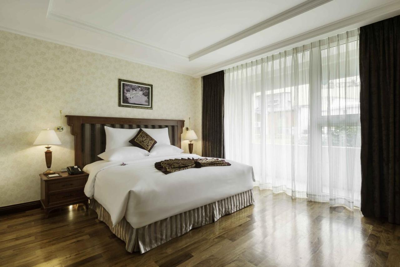 Rex Hotel Cidade de Ho Chi Minh Exterior foto A bedroom at the hotel